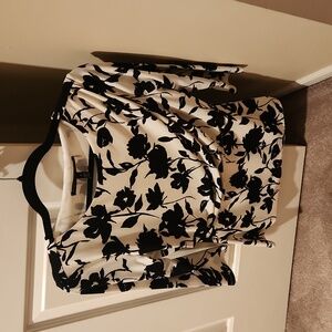White and black floral blouse, size small.